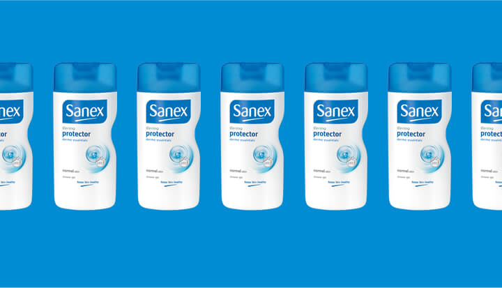 Six bottles of Sanex protector deodorant lined up on a blue background.
