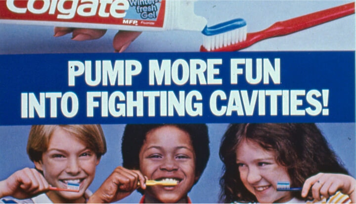 Ad from the 1960s for Colgate toothpaste showing three children holding toothbrushes, with text reading "Pump More Fun Into Fighting Cavities".